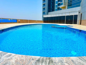 Luxury Home seafront view 1BHK pool gym wifi